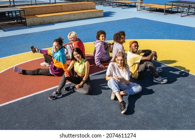 Multicultural Group Of Young Friends Bonding Outdoors And Having Fun - Stylish Cool Teens Gathering At Urban Skate Park