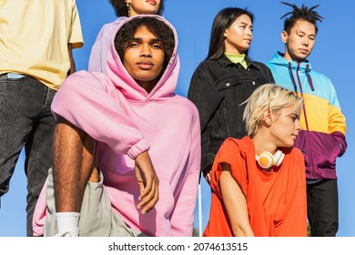 Multicultural group of young friends bonding outdoors and having fun - Stylish cool teens gathering at urban skate park - Shutterstock ID 2074613515