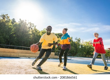 Multicultural Group Of Young Friends Bonding Outdoors And Having Fun - Stylish Cool Teens Gathering At Basketball Court, Friends Playing Basketball Outdoors