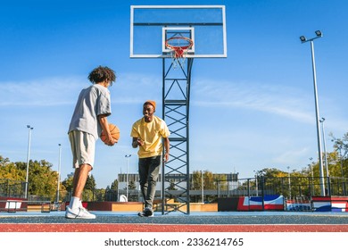 Multicultural group of young friends bonding outdoors and having fun - Stylish cool teens gathering at urban skate park - Powered by Shutterstock