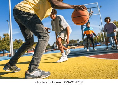 Multicultural group of young friends bonding outdoors and having fun - Stylish cool teens gathering at urban skate park - Powered by Shutterstock