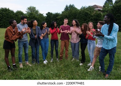 Multicultural Group Of Young People Clapping Hands And Having Fun Together