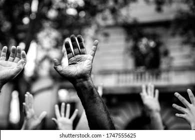 Multicultural Hands Raised In The Air Asking For Freedom. Stop Racism. Stop Repression.