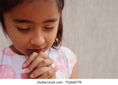 Multicultural Hispanic Girl Child Praying With Eyes Closed, Christianity Faith Concept