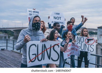 multicultural people holding placards while gesturing during protest 
