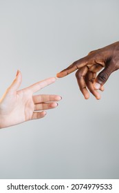 Multicultural Relationship. Globe Immigration. Racial Tolerance. Closeup Of Diverse Couple Hands Reaching Fingers Isolated On Neutral Copy Space Background.