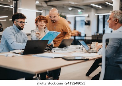 Multicultural team collaborating on digital marketing and target audience analysis for small business growth. - Powered by Shutterstock