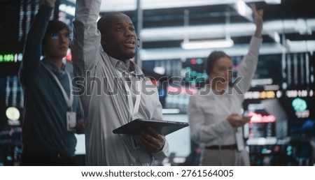 Multicultural Team of Professional Traders Standing in Active Trading Pit, Simultaneously Gesture, Shouts Orders, and Checks Their Tablets. Concept Synchronized Teamwork and Rapid Crisis Management.