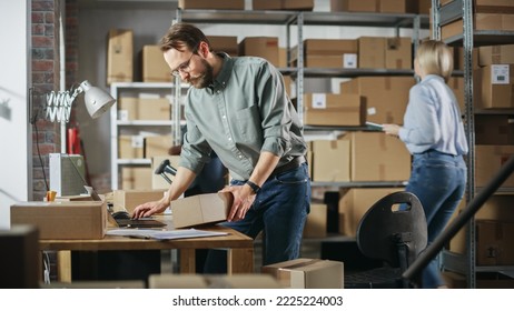 Multicultural Team Of Warehouse Employees At Work In Retail Shop's Storeroom. Small Business Owners And Inventory Managers Working On Laptop, Packing Parcels For Delivery.