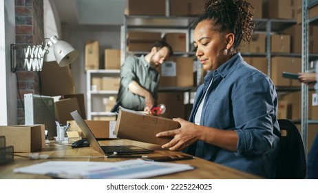 Multicultural Team Of Warehouse Employees At Work In Retail Shop's Storeroom. Small Business Owners And Inventory Managers Working On Laptop, Tablet, Packing Parcels For Delivery.