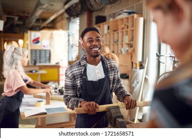 Multi-Cultural Team In Workshop Assembling Hand Built Sustainable Bamboo Bicycle Frame - Shutterstock ID 1721658571