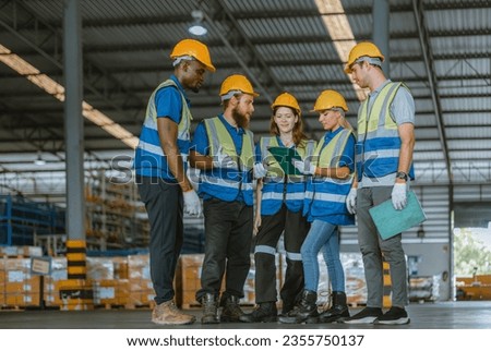 Multicultural warehouse staff creates logistical atmosphere that encourages empowerment, confidence. The collaborative and diverse team results in excellent performance and a strong sense of unity.