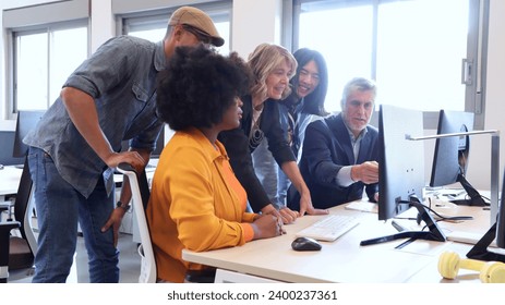 Multicultural work team working together on a project in an office