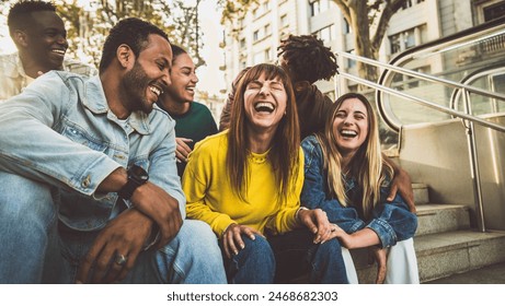 Multicultural young people having fun on city street - Happy group of friends hanging outside - University students standing together in college campus - Youth culture and life style concept - Powered by Shutterstock