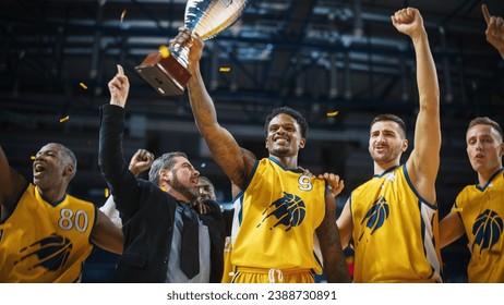 Multiethnic Basketball Players Celebrate Championship Victory with Hugs, Jumping, Holding the Trophy. Exclusive Joyful Sports Action on Live TV and Pay Per View Internet Streaming Concept. - Powered by Shutterstock