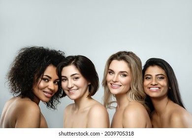 Multi-ethnic beauty and friendship. Group of beautiful  different ethnicity women on gray background