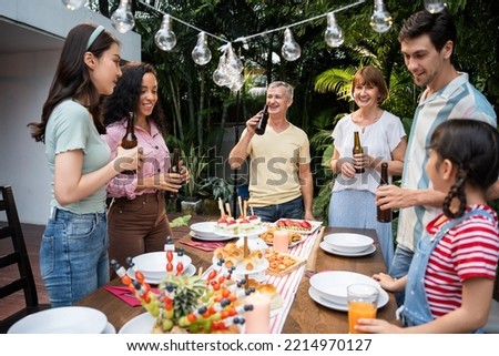 Similar – Freunde essen Kuchen und haben Spaß auf der Party.