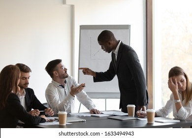 Multi-ethnic business partners having conflict accuse each other at group meeting in boardroom unpleasant situation caused by personal dislike, racial discrimination, struggle for leadership concept