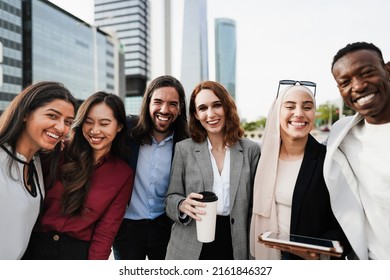 Multiethnic Business People Celebrating Outside Of The Office With City In Background - Main Focus On Center Woman Face