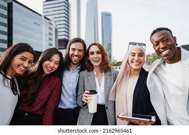 Multiethnic Business People Celebrating Outside Of The Office With City In Background - Main Focus On Center Girl Face