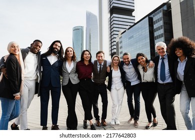 Multiethnic Business People Celebrating Outside Of The Office With City In Background - Focus On Center Faces