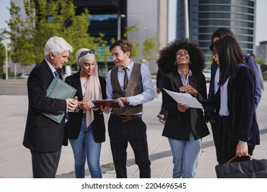 Multiethnic Business People Working Outside Of Office Building In The City