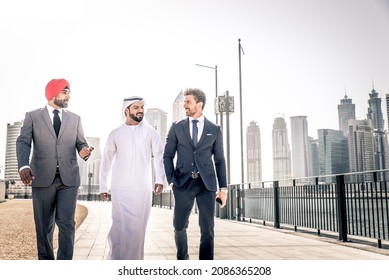 Multiethnic business team meeting outdoors - Three businessmen talking about business on a formal meeting - Shutterstock ID 2086365208