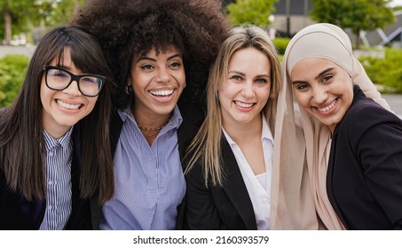 Multiethnic Business Women Smiling On Camera During Lunch Break Outside Of Office