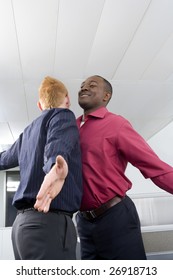 Multi-ethnic Businessmen Chest Bumping