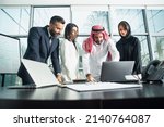 Multiethnic corporate business team meeting in the office for a strategic marketing plan - Office workers, entrepreneurs and company employee at work in a multinational company