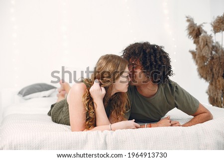 Similar – Happy young couple in love smiling under duvet cover