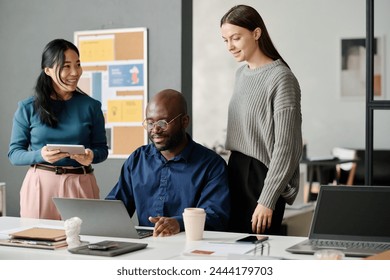 Multi-ethnic Coworkers Working In Office - Powered by Shutterstock