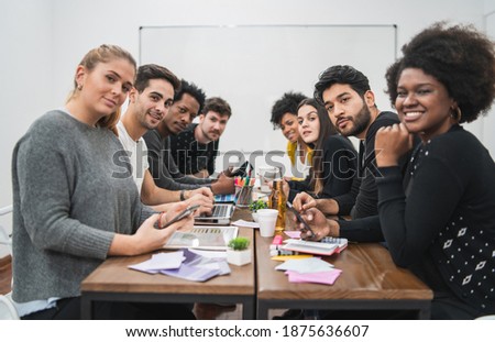 Multiethnic creative people having a brainstorming meeting.