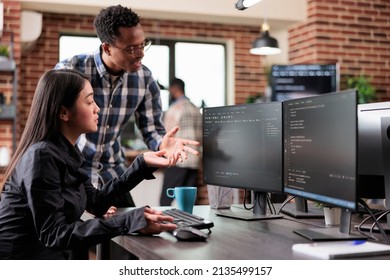 Multiethnic cyber security team developing software algorithm for information processing and network optimization. Informational agency multiracial tech enginners programming application while using - Shutterstock ID 2135499157