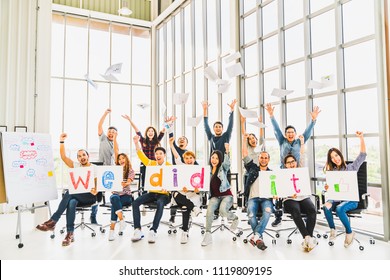 Multiethnic diverse group of happy business people cheering together, celebrate project success with papers wrote words We did it. Coworkers teamwork, career job achievement, or small business concept - Shutterstock ID 1119809195