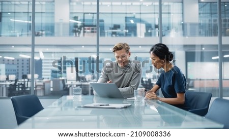 Multiethnic Diverse Office Conference Room Meeting: Team of Two Creative Entrepreneurs Talk, Discuss Growth Strategy. Stylish Young Businesspeople work on Investment and Marketing Projects.