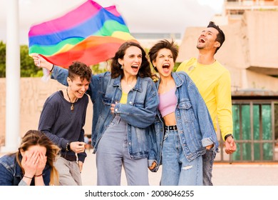 Multiethnic Diversity LGBTQ Group With Rainbow Flag. Friends For Gender Expression And Identity Pride. Homosexual, Lesbian, Bisexual, Nonbinary,