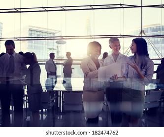 Multi-Ethnic Group Of Business People Working In A Board Room - Powered by Shutterstock