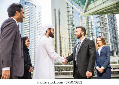 Multiethnic group of businesspeople meeting outdoors in a modern city