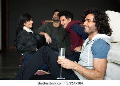 Multiethnic Group Of Friends Hanging Out On Saturday Night. Partying On Saturday Night