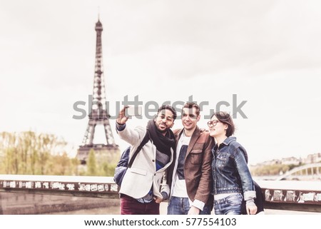 Multi-ethnic Group Of Friends Having Fun In Paris Along Seine