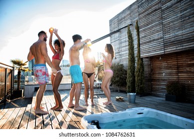 Multi-ethnic group of friends having party on  rooftop - Happy people bonding and having fun - Shutterstock ID 1084762631