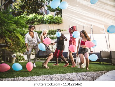 Multiethnic Group Of Friends Making Party In A Lounge Bar - Cheerful Young Adults Having Fun And Celebrating In A Backyard Garden With Swimming Pool