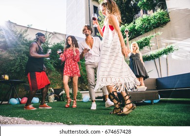 Multiethnic Group Of Friends Making Party In A Lounge Bar - Cheerful Young Adults Having Fun And Celebrating In A Backyard Garden With Swimming Pool