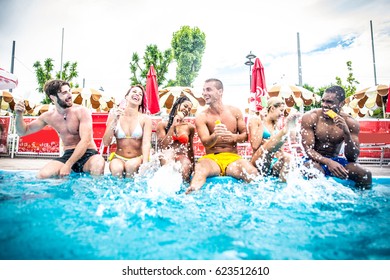 Multi-ethnic Group Of Friends In A Swimming Pool - Young Happy People Having Fun And Enjoying Summertime In A Aquapark