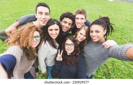 Multiethnic Group of Friends Taking Selfie at Park - Shutterstock ID 235929577