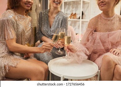 Multi-ethnic Group Of Glamorous Young Women Clinking Champagne Glasses While Enjoying Party, Close Up