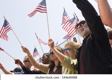 Multiethnic Group Of People With American Flag During A Rally