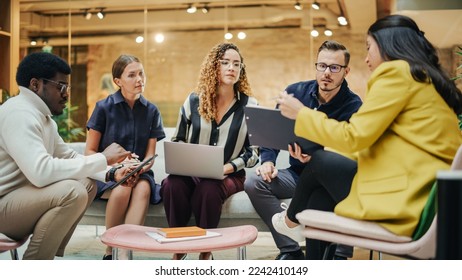 Multiethnic Group of People Brainstorming in a Conference Room at the Office. Successful Young Female Head of Operations Consulting Other Team Leads on a Future Project. - Powered by Shutterstock