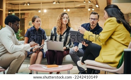 Multiethnic Group of People Brainstorming in a Conference Room at the Office. Successful Young Female Head of Operations Consulting Other Team Leads on a Future Project.
